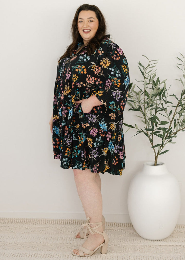 plus-size knee-length button-down black and floral dress with pockets and long sleeves