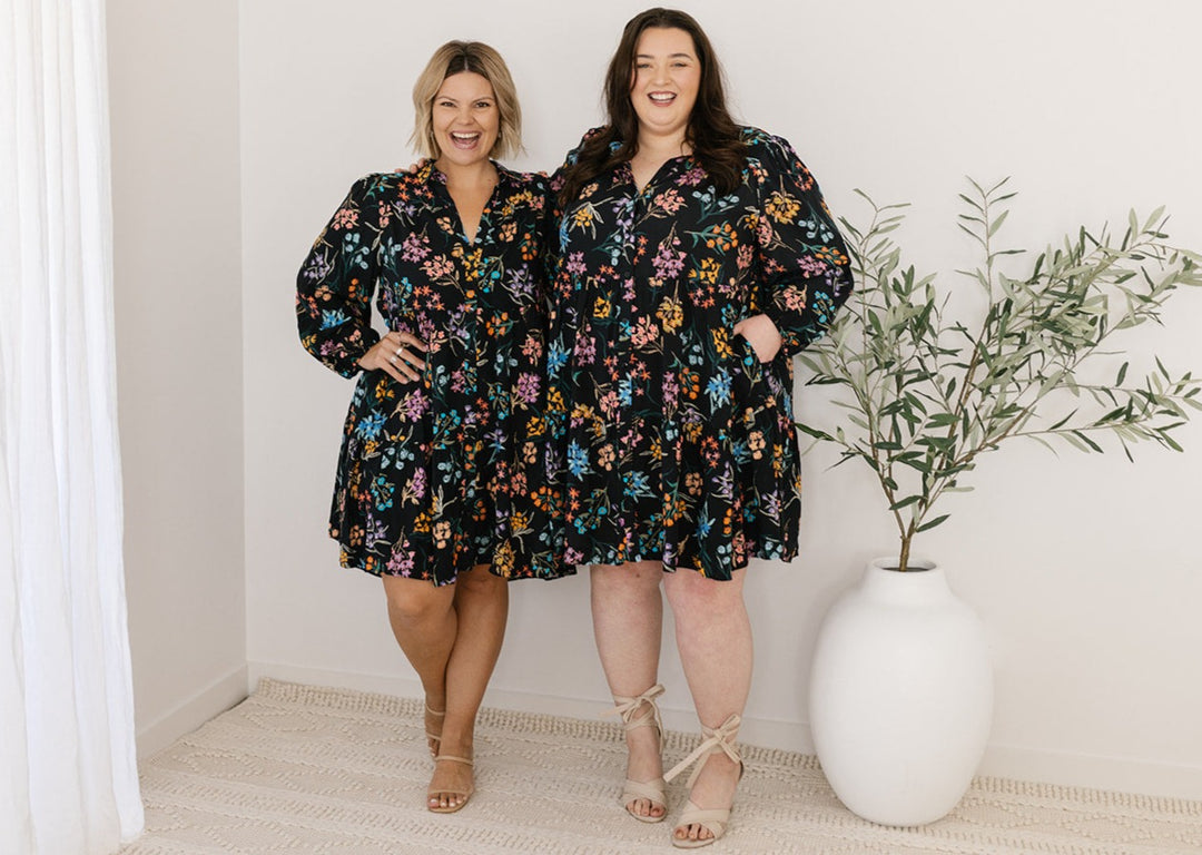 plus-size knee-length button-down black and floral dress with pockets and long sleeves