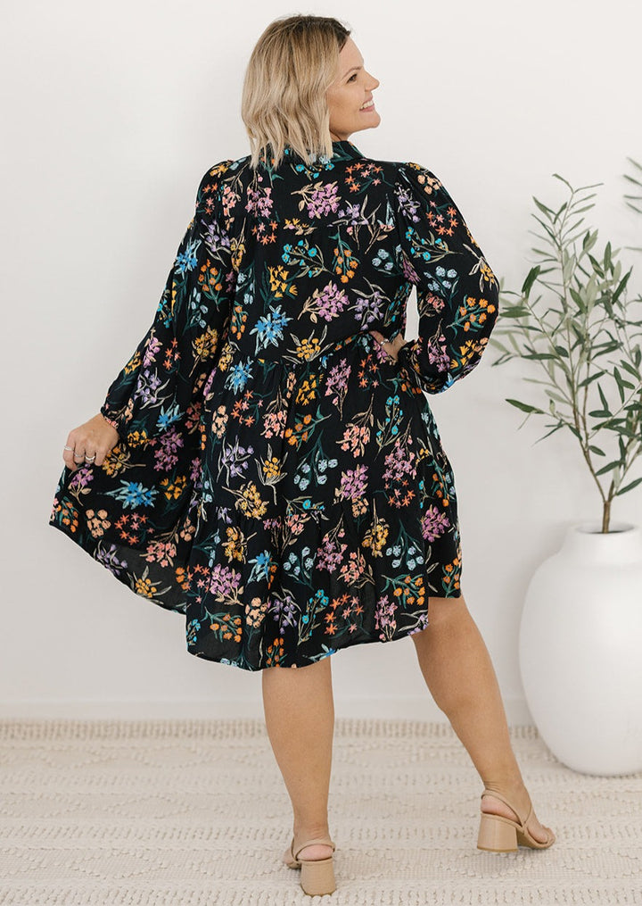 plus-size knee-length button-down black and floral dress with pockets and long sleeves