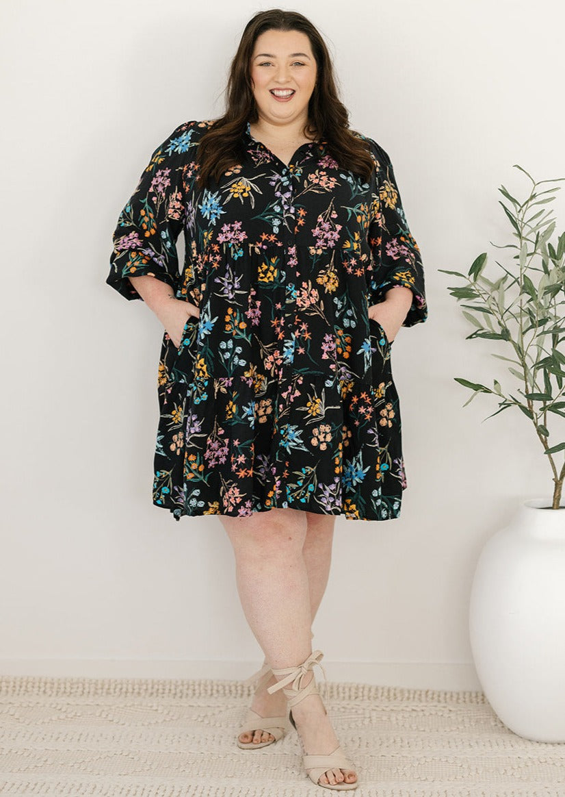 plus-size knee-length button-down black and floral dress with pockets and long sleeves