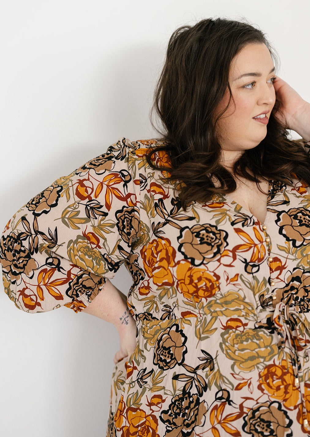 plus-size neutral floral maxi dress with drawstring waist, pockets and long sleeves