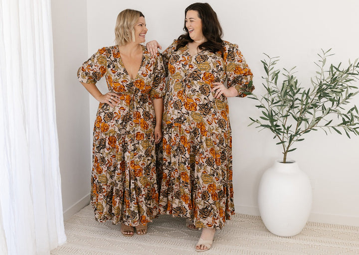 plus-size neutral floral maxi dress with drawstring waist, pockets and long sleeves