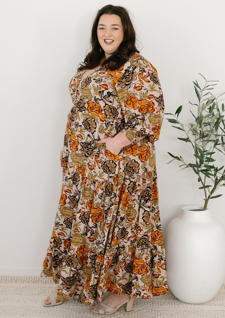 plus-size neutral floral maxi dress with drawstring waist, pockets and long sleeves