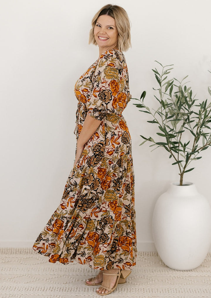 plus-size neutral floral maxi dress with drawstring waist, pockets and long sleeves