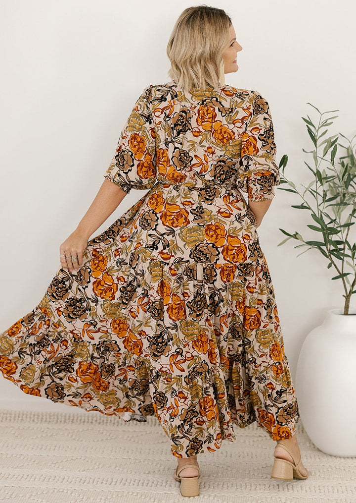 plus-size neutral floral maxi dress with drawstring waist, pockets and long sleeves