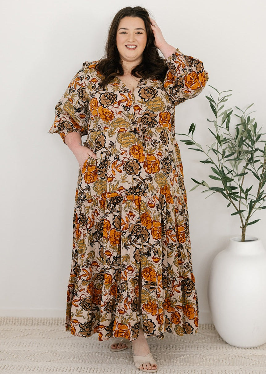 plus-size neutral floral maxi dress with drawstring waist, pockets and long sleeves