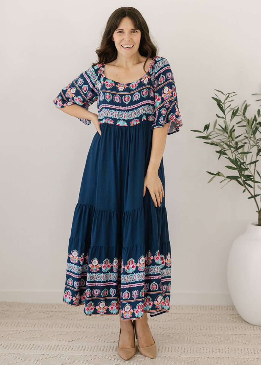 Navy midi dress with floral border and shirred back 