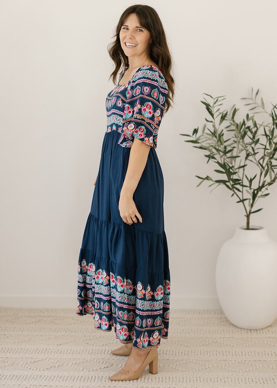 Navy midi dress with floral border and elbow-length sleeves 