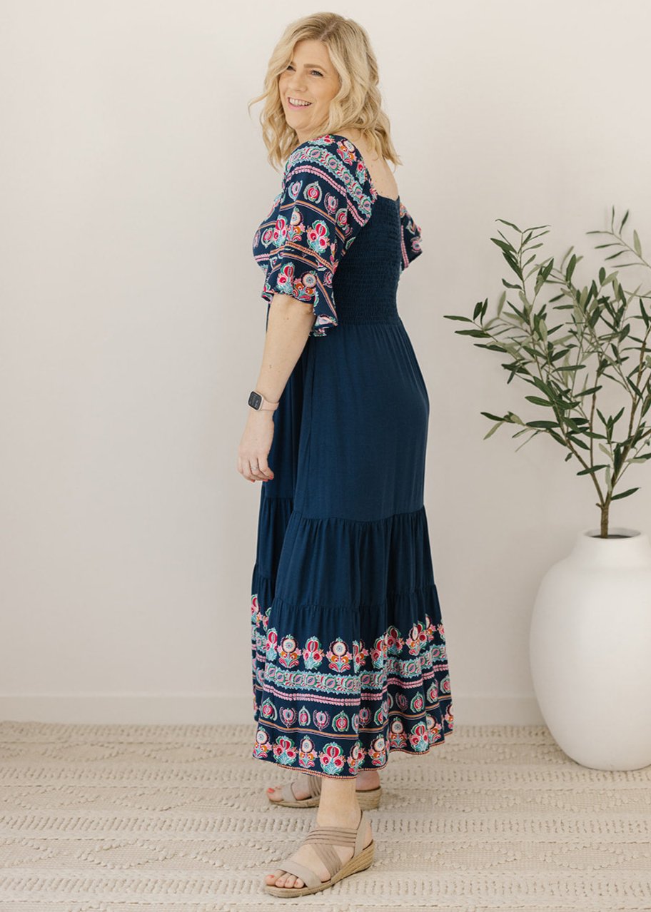 Bump-friendly navy midi dress with floral border