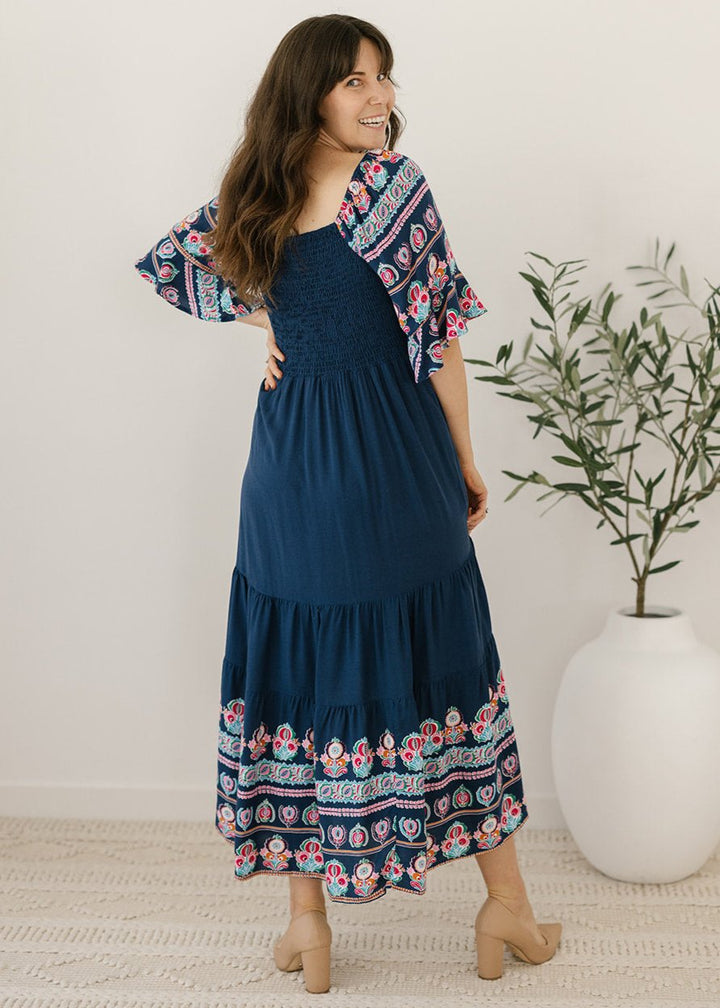 Navy midi dress with floral border and pockets