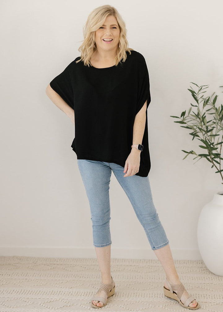 Women’s flowy black plus-size blouse