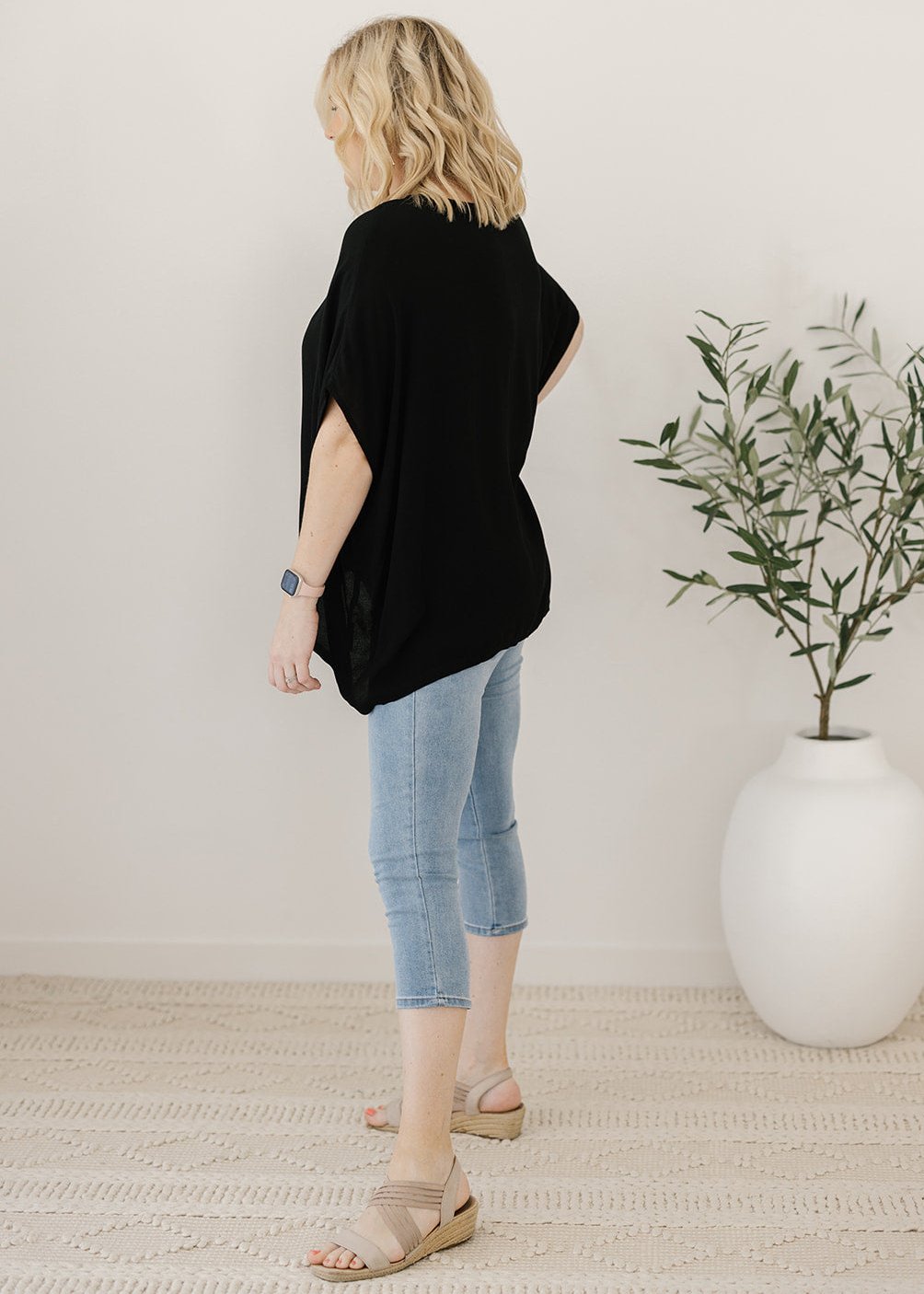 Women’s flowy black plus-size blouse