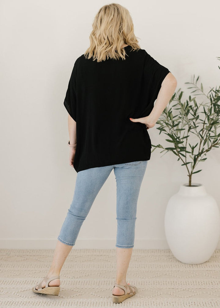 Women’s flowy black plus-size blouse