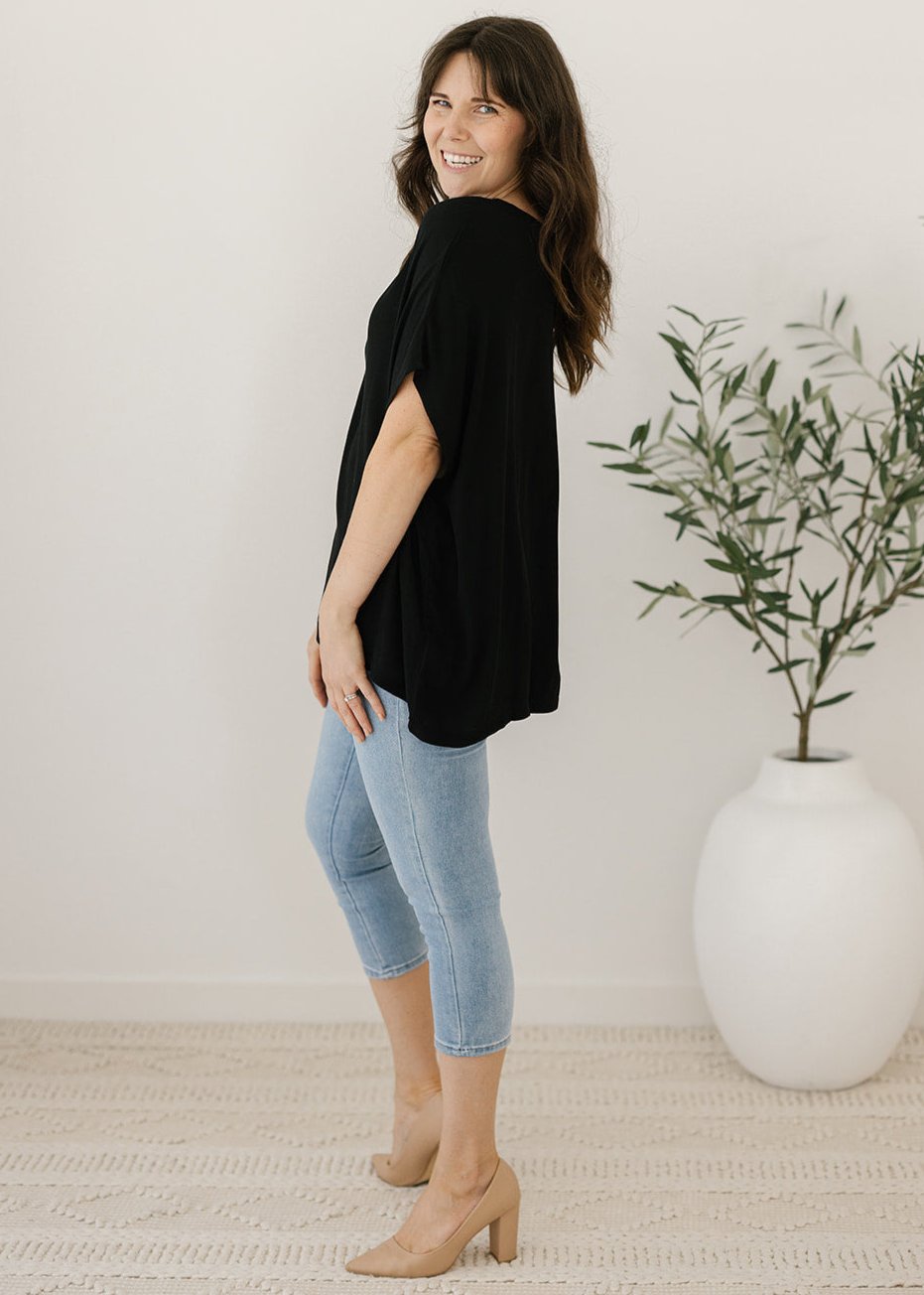 Women’s flowy black plus-size blouse