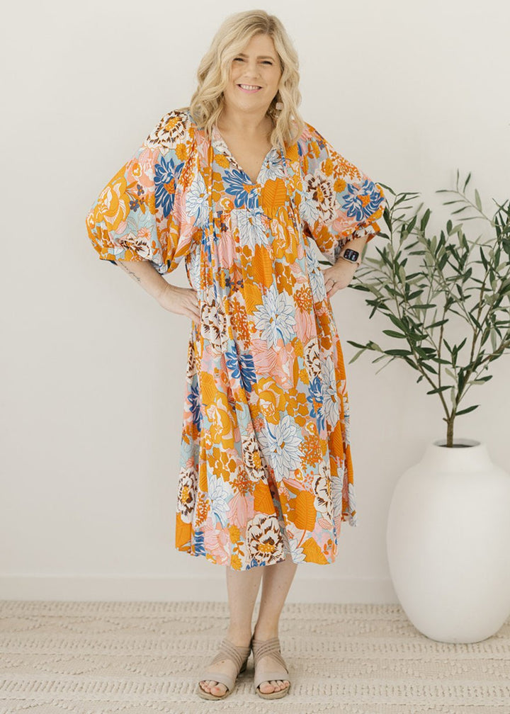 orange and blue floral smock-style maxi dress