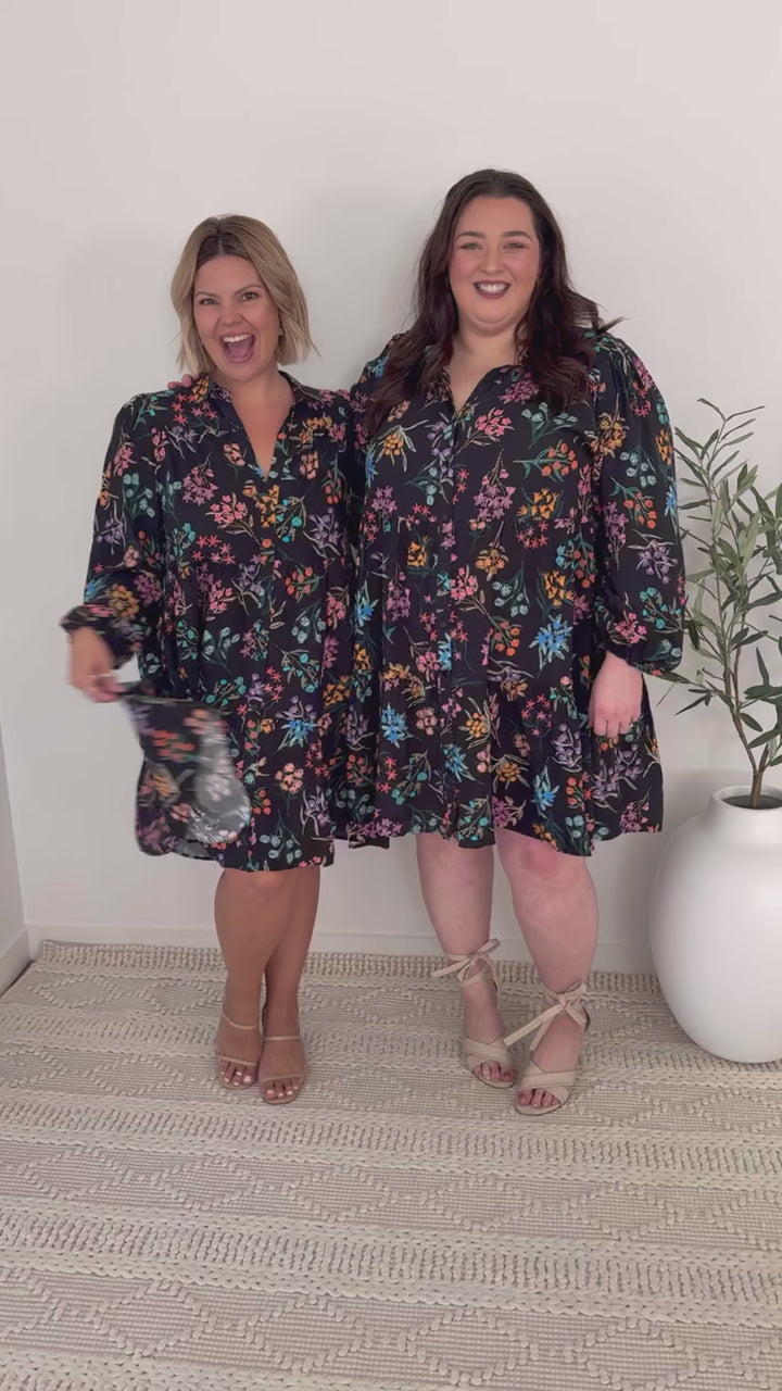 plus-size knee-length button-down black and floral dress with pockets and long sleeves