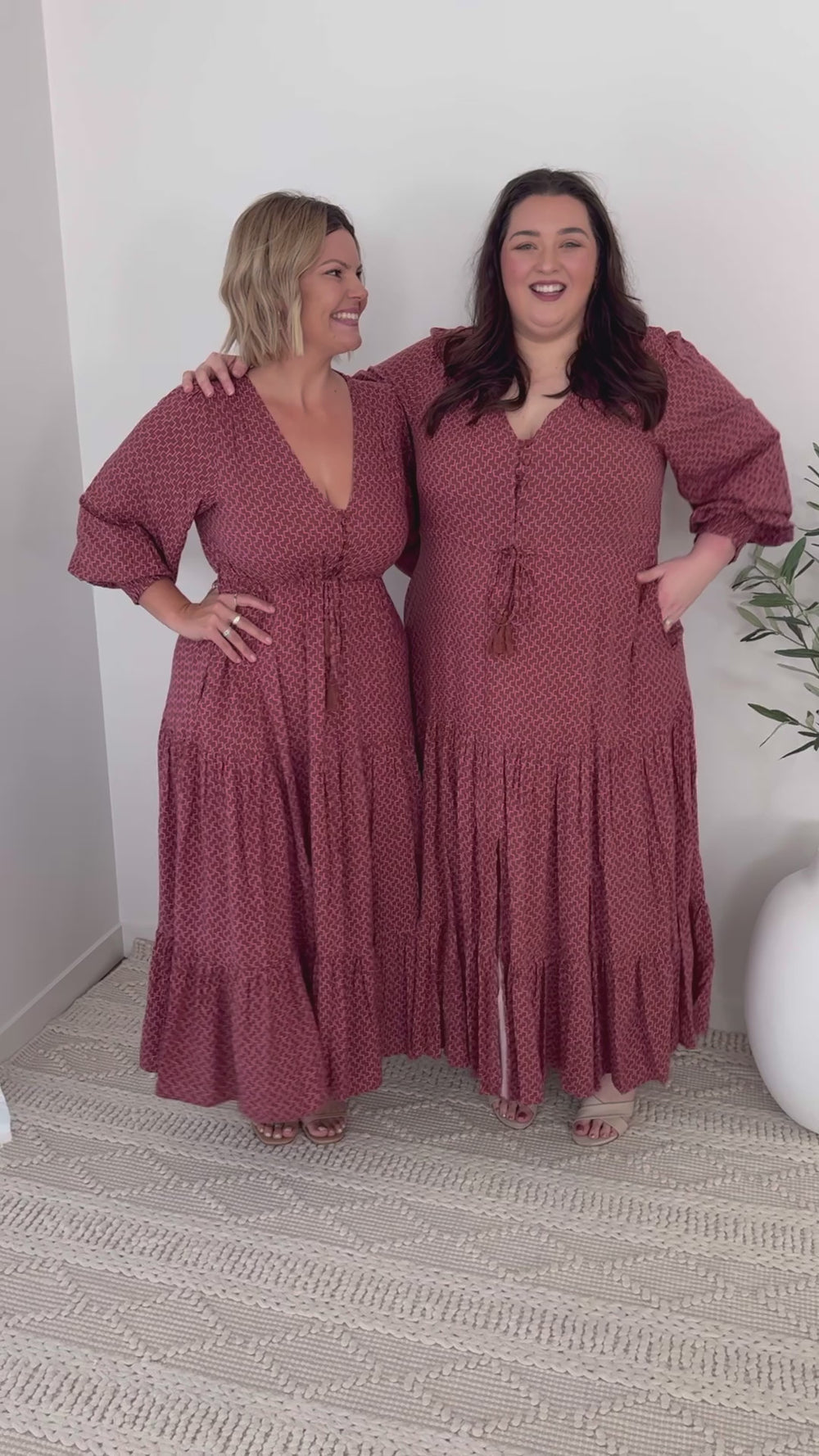 plus-size brown and pink geometric print maxi dress with long sleeves, pockets and drawstring waist