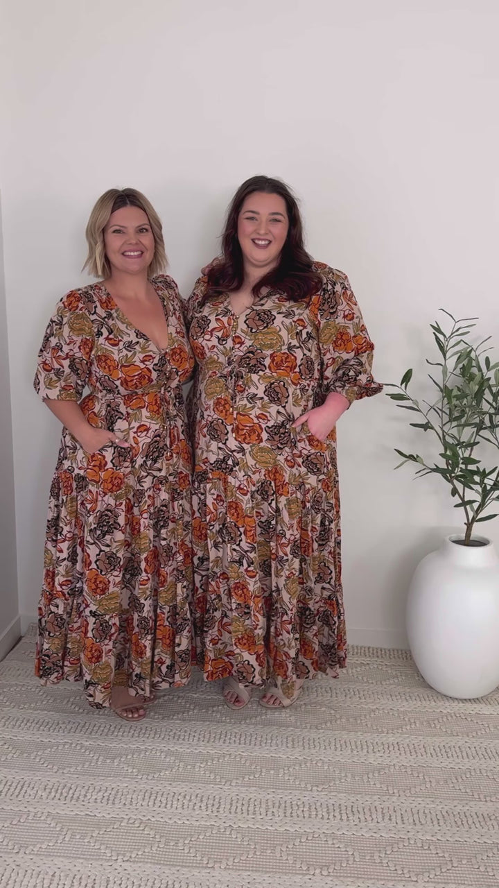 plus-size neutral floral maxi dress with drawstring waist, pockets and long sleeves